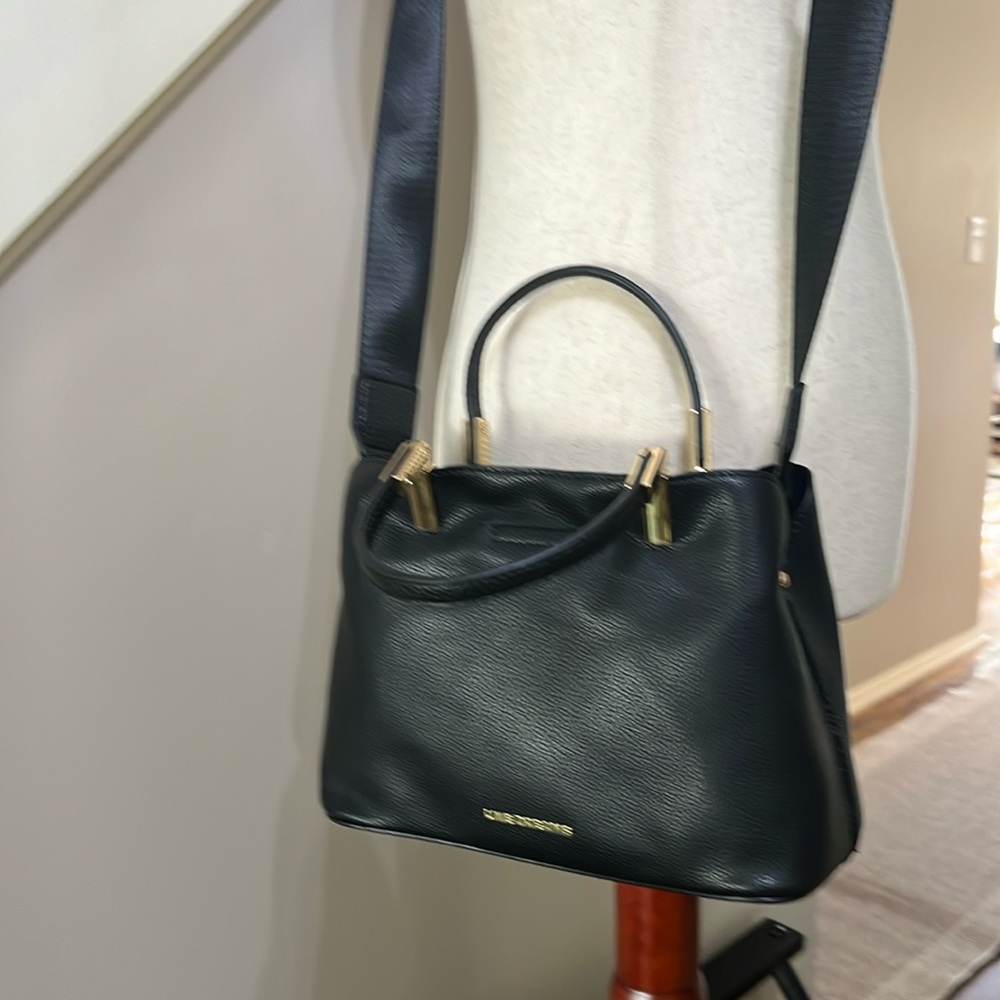 Black PU leather crossbody with adjustable straps and gold hardware. NWOT